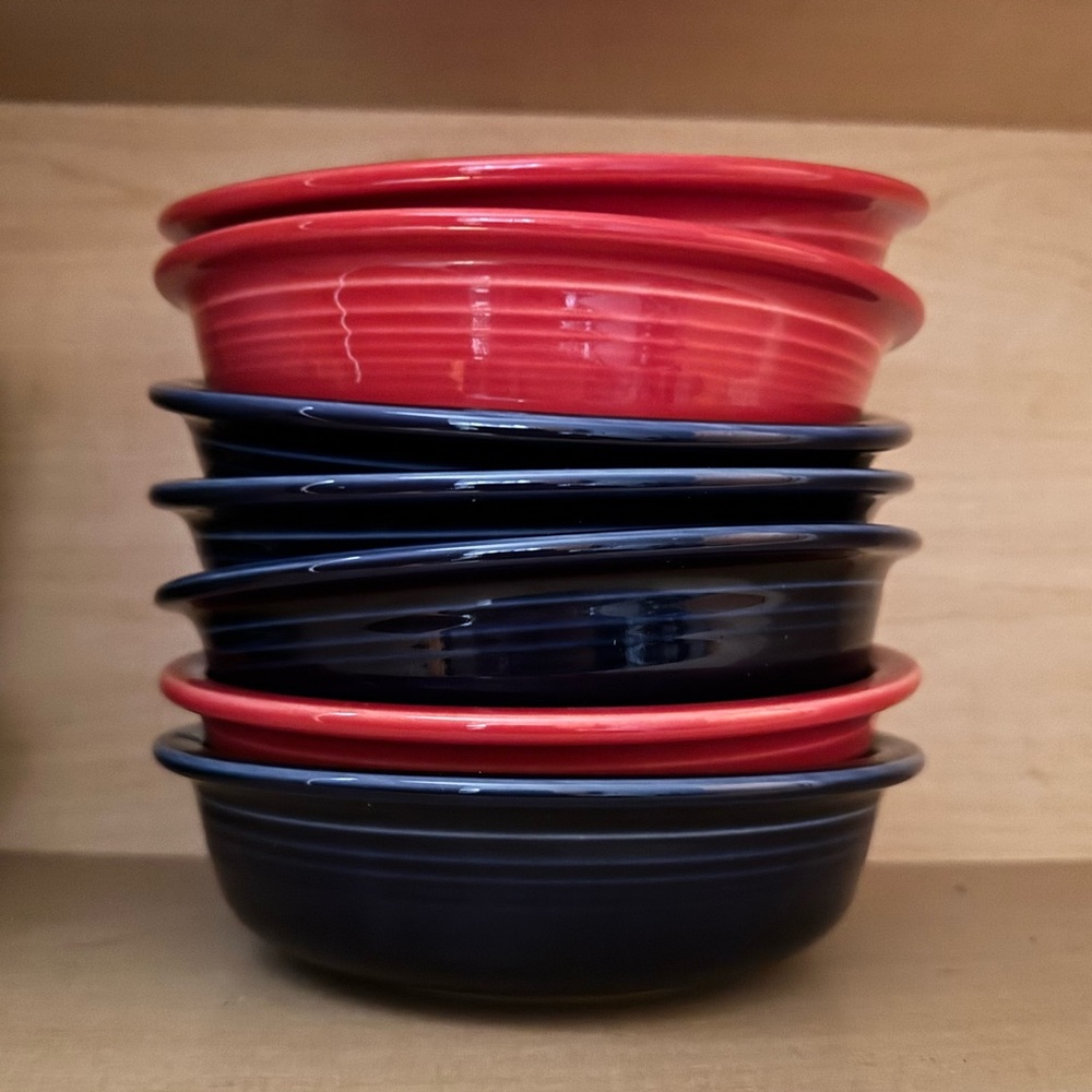 Fiesta medium bowls. Three red, four blue.